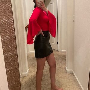 Red top with flared sleeves, very flattering on